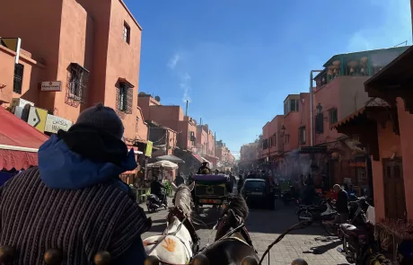 The bustling streets of Marrakech's Souks taken from a horse drawn tourist carriage