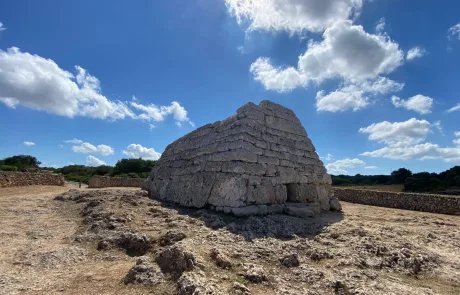 a picture of stone burial chamber in Menorca, spain called Naveta d'Es Tudons
