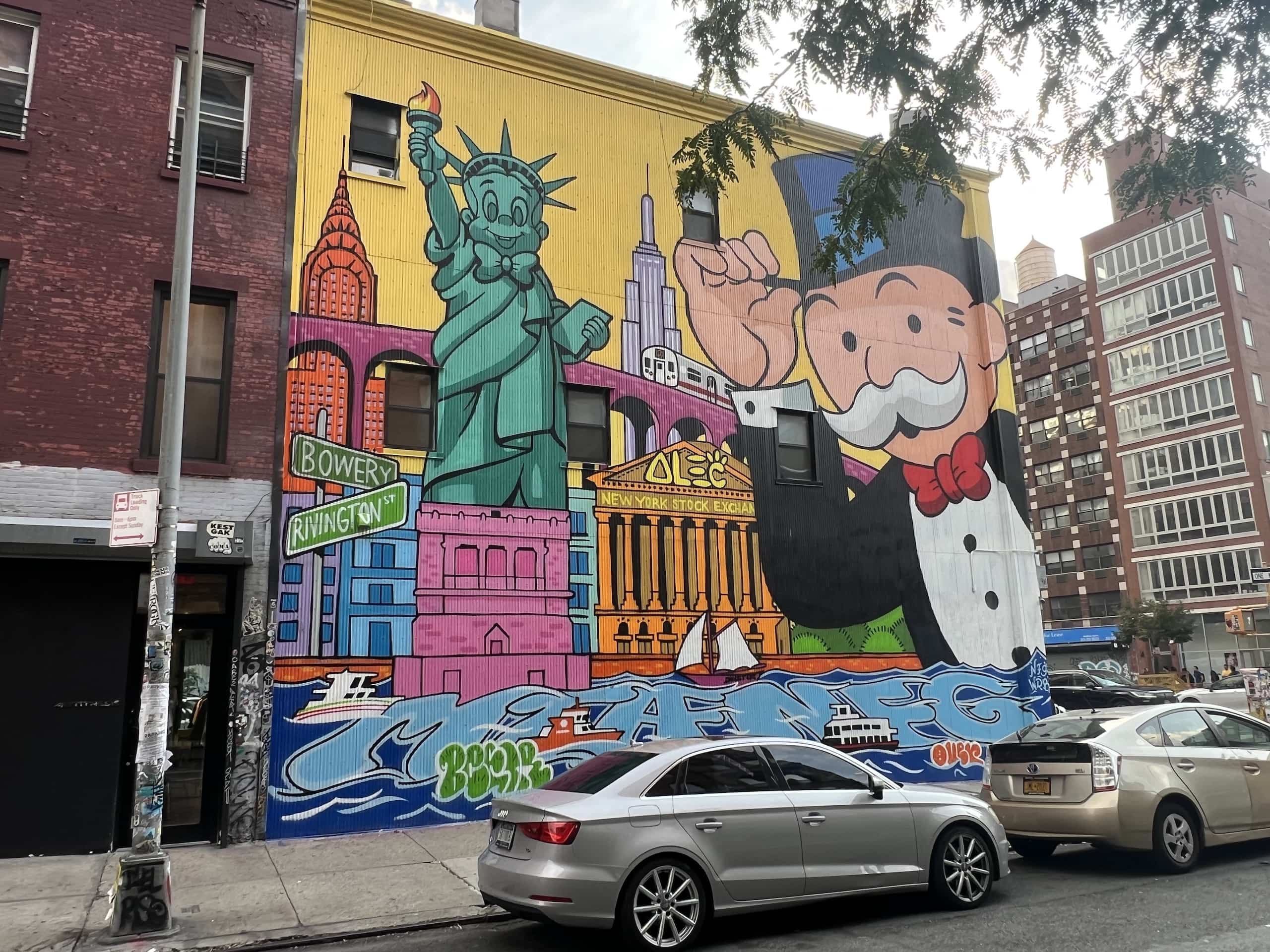East_Coast_Roadtrip_New_York_00021 Graffiti in teh Lower East side of New York featuring a brightly coloured depiction of the Monopoly Man, The Statue of liberty and various New York buildiings