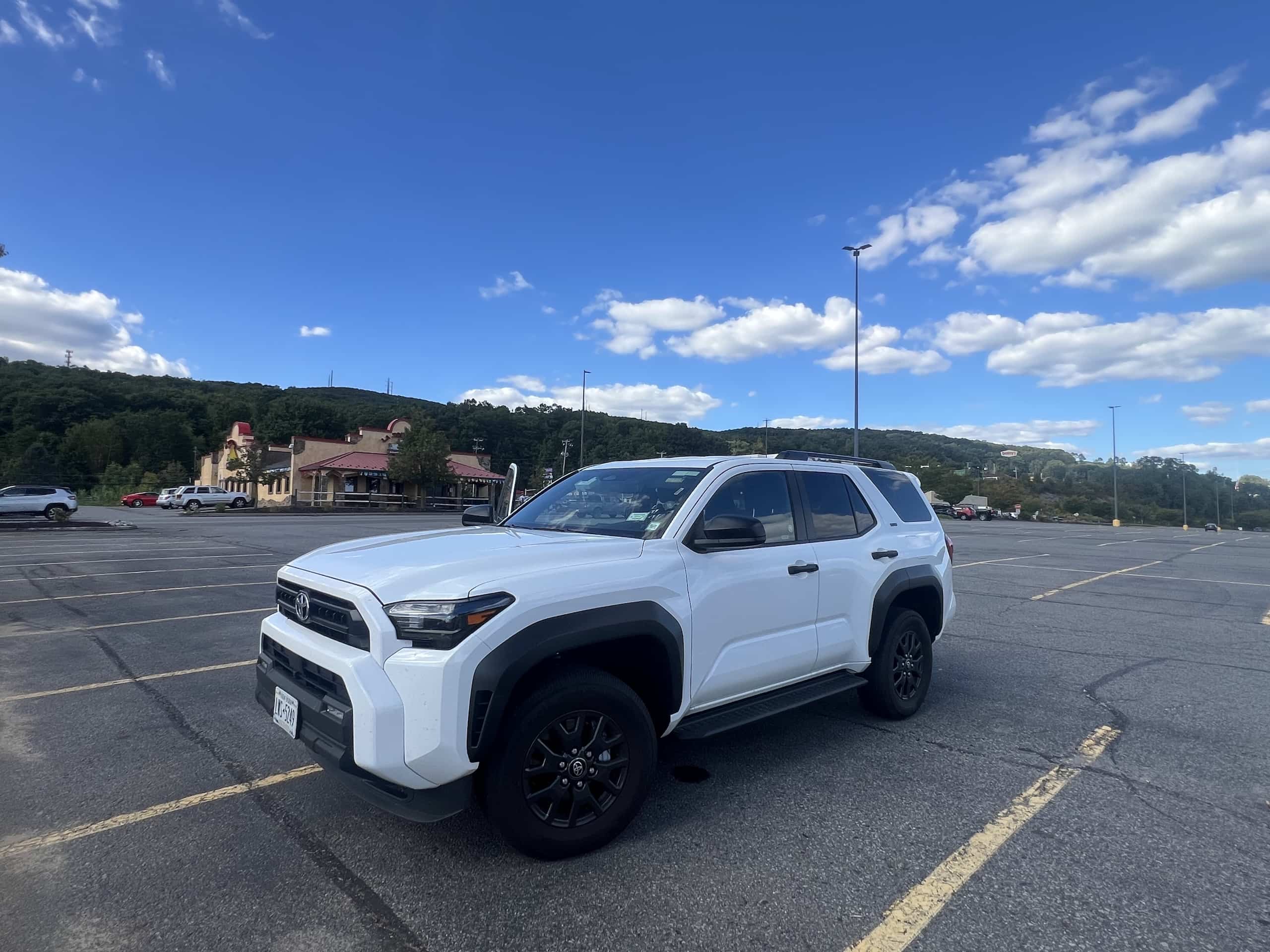 East_Coast_Roadtrip_New_York_Ithaca_00020 a white Toyota 4Runner SUV, our rental car for our East Coast USA Road Trip - front three quarter view