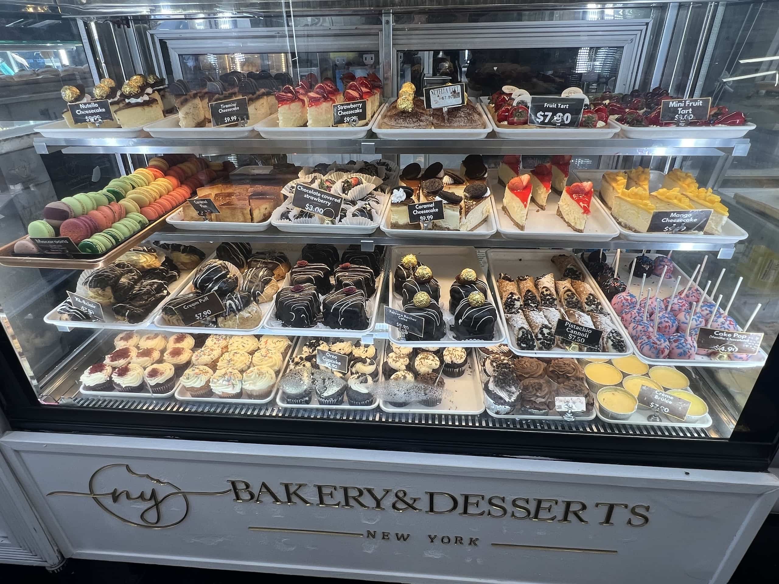 East_Coast_Roadtrip_New_York_b00004 a cabinet full of cakes and pastries at New York Bakery & Desserts in Times Square New York