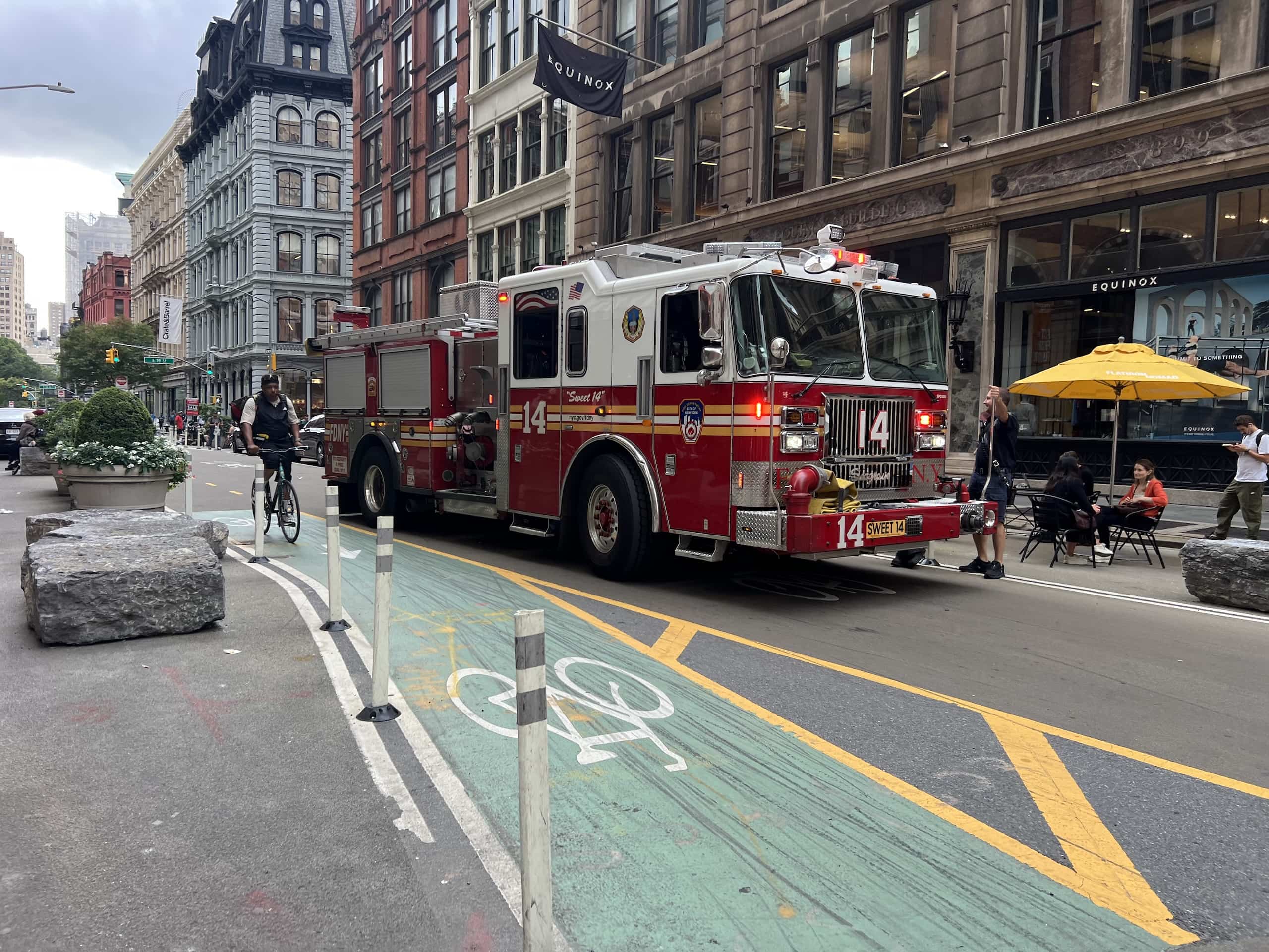 East_Coast_Roadtrip_New_York_c00001 A New York City Fire Engine driving down a street