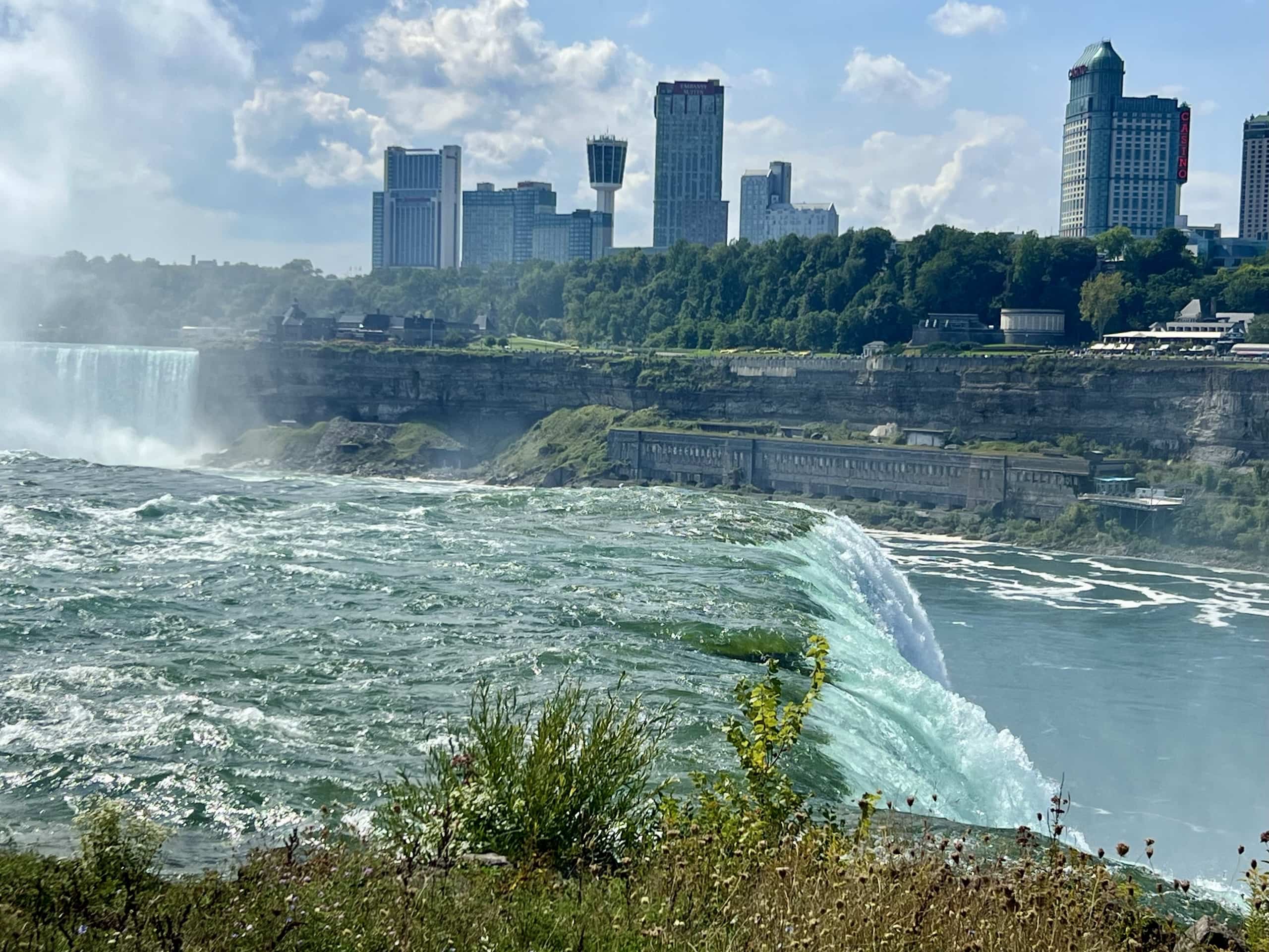 East_Coast_Roadtrip_Niagara_00008 A view ove Niagara Falls with Canadian skyscrapers in the background taken from the American side