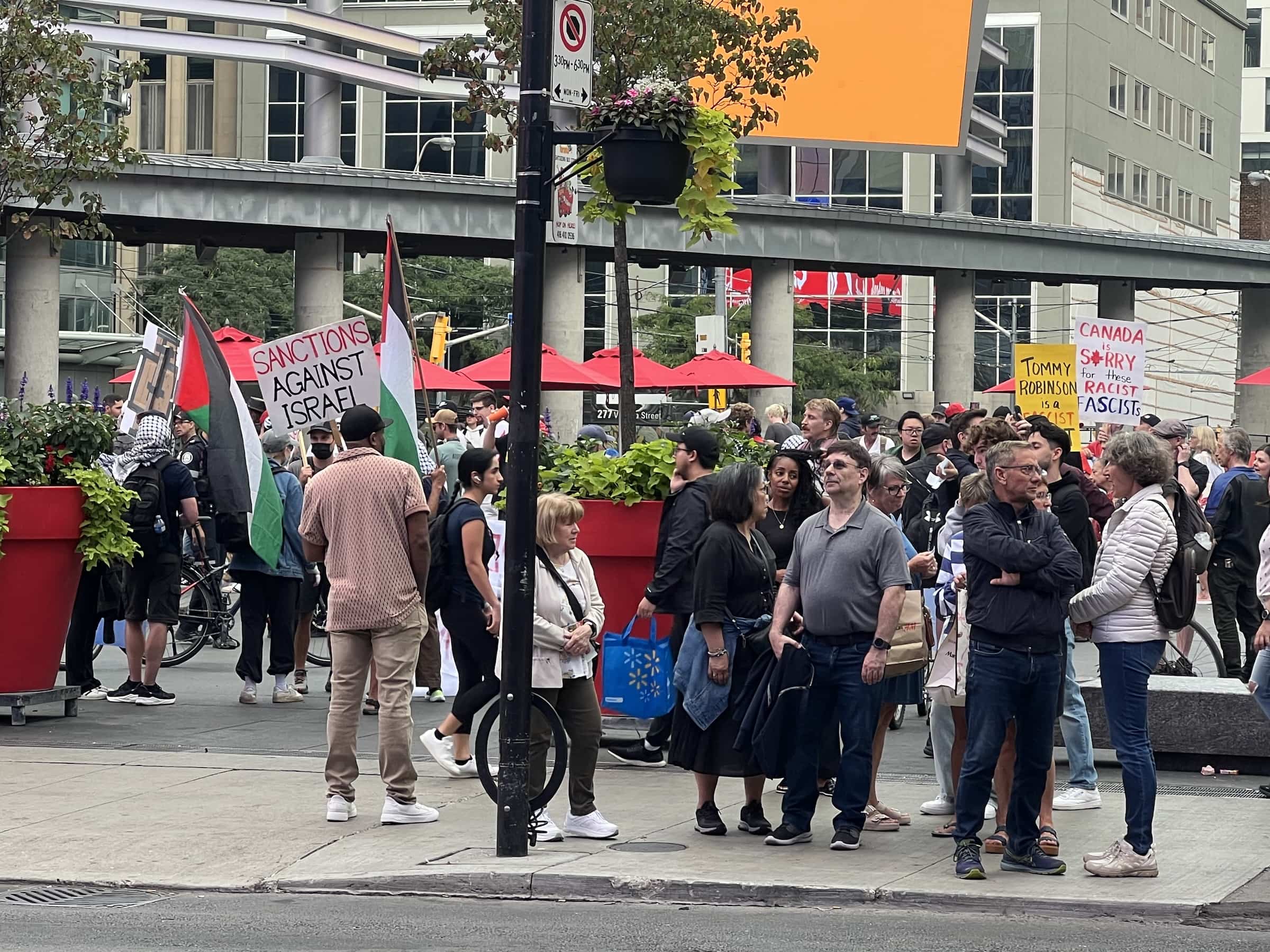 East_Coast_Roadtrip_views_from_passenger_side_gallery_01-00041 A crowd of rotesters on Dundas Square in Toronto waving political plaques