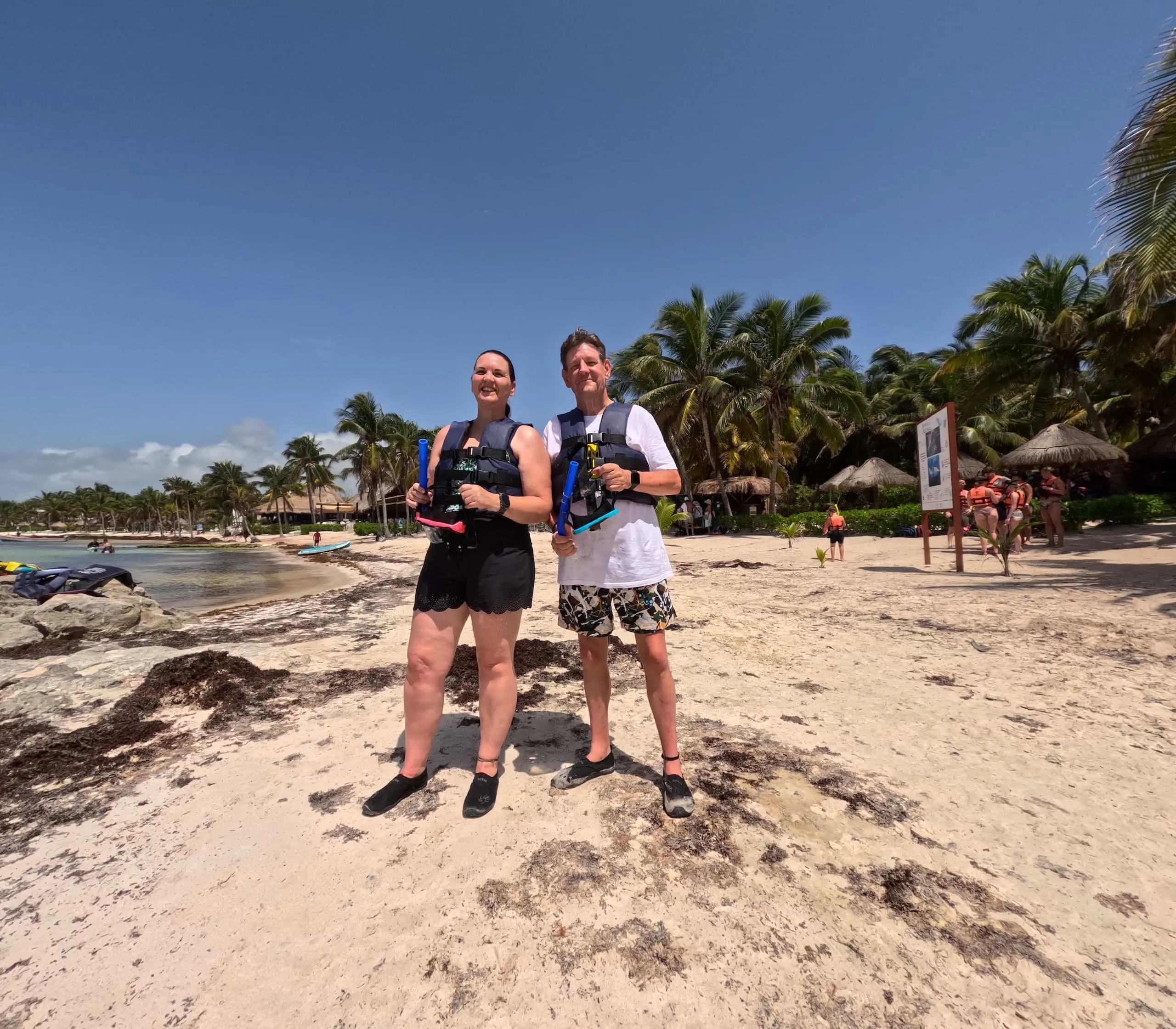 Dave and Deb wearing snorkelling equipment on the beach in Akumal, Mexico